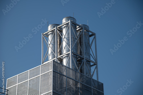 A large metal structure with four tanks on top of it