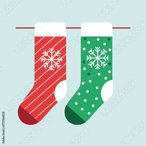 Colorful red and green Christmas stockings hanging on a line.