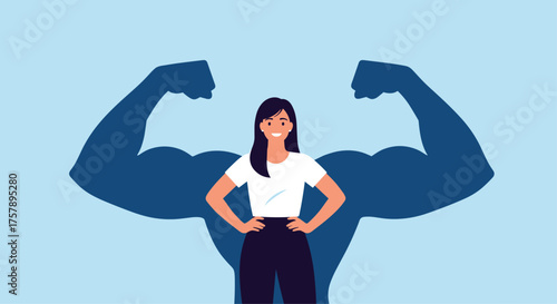 A strong woman stands with her hands on her hips casting a powerful muscular shadow.