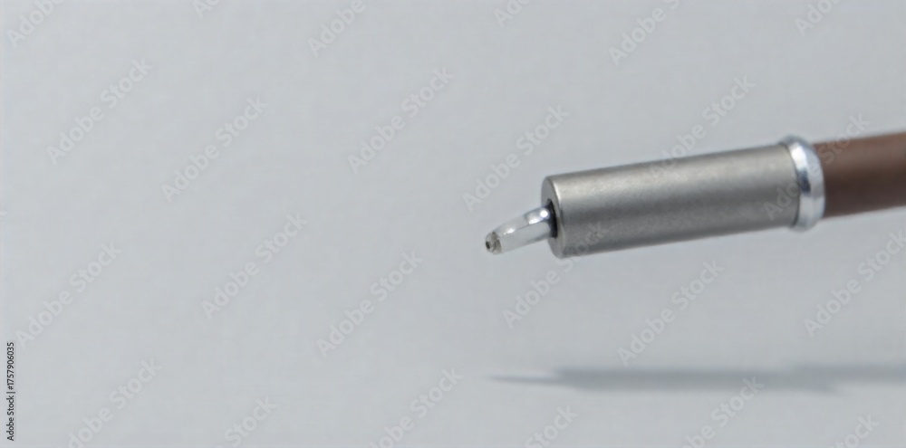 Naklejka premium Stethoscope Head and Tubing, Macro View, Texture and Detail Focus Extreme macro shot of the head and part of the tubing of a doctor s stethoscope. Focus on the fine details of the metal and rubber