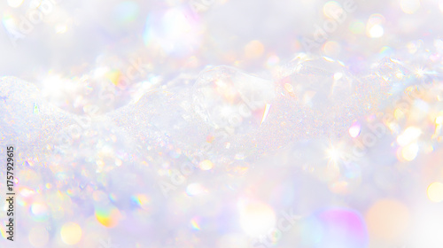 Prism background with rainbow light shining on a silver background.