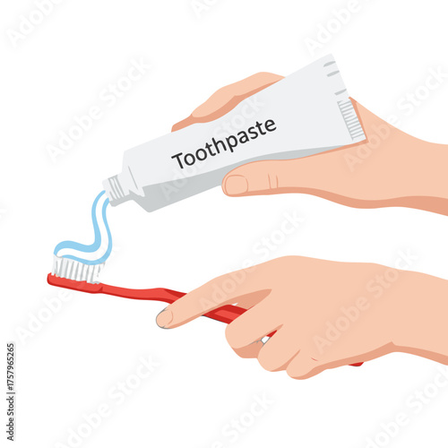 Hand squeezing toothpaste onto toothbrush, closeup view