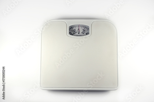 White analog bathroom scale a tool for weight measurement and health tracking isolated on a clean white background
