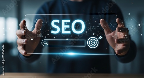 Person holding a digital interface displaying SEO search bar and target with arrow search engine optimization