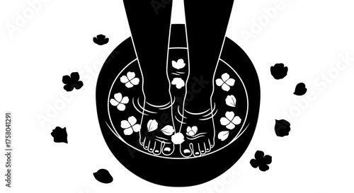 Feet soaking in a basin filled with water and flower petals