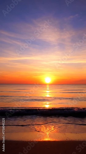 Vibrant sunset over ocean horizon with colorful sky reflection