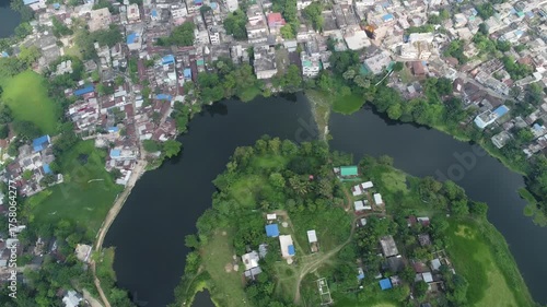 full hd drone shot video clip of naturally formed ox bow lake in between a city in west bengal india