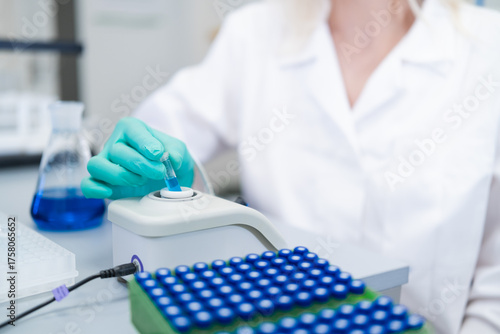 Analytical chemist preparing samples for HPLC analysis to identify and quantify compounds