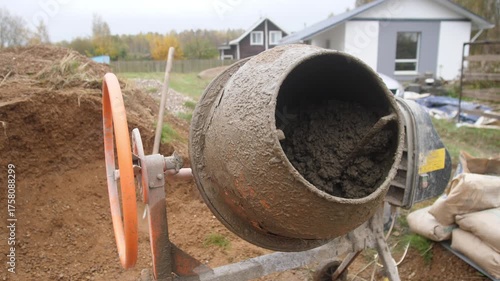 Wallpaper Mural A concrete mixer mixes concrete during the construction of a private house Torontodigital.ca