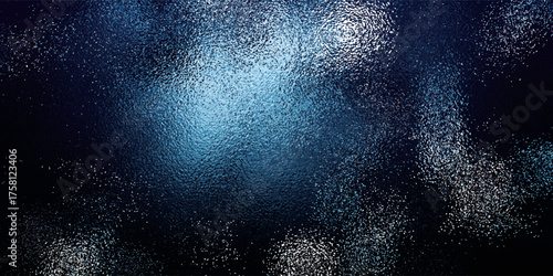 Abstract Dark Blue Texture with Light Center and Speckled Pattern.