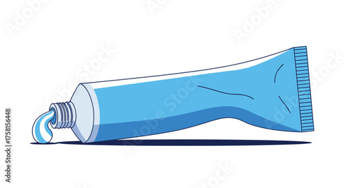 A blue tube of toothpaste squeezed out onto a white surface.