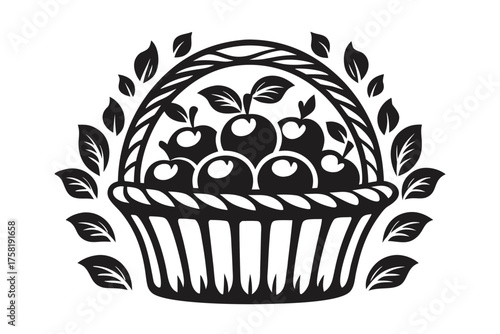 Basket overflows with ripe apples, adorned with leaves in a black and white motif
