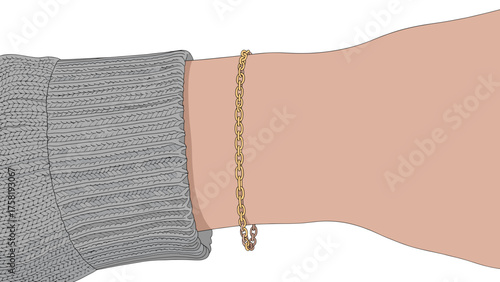 Golden bracelet on wrist of hand wearing grey sweater  