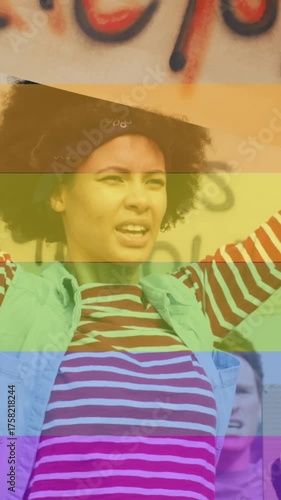 Animation of rainbow over diverse protesters with banners