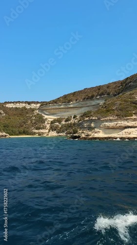 Rocky cliffs seen from the sea. Coastal cliffs. Corsica