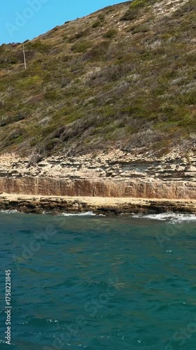 Rocky cliffs seen from the sea. Coastal cliffs. Corsica