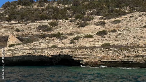 Rocky cliffs seen from the sea. Coastal cliffs. Corsica