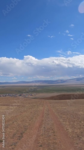 Driving along a country road in Altai desert and semi-desert environment.