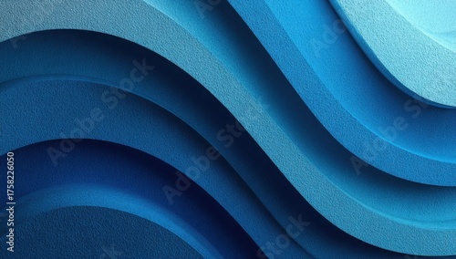 Curved layers of textured blue paper forming a spiral abstract pattern with smooth gradients and dramatic light and shadow play.