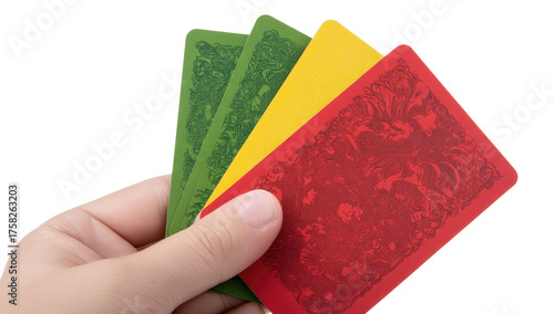 A hand holds four playing cards, vibrant backs. Green, yellow, and red cards