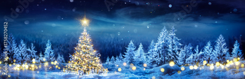 Christmas Tree On Snow - Winter Fir Forest At Night Forest - Pine Tree With Gift Boxes And With Shiny Star In Blue Landscape And Abstract Bokeh Lights