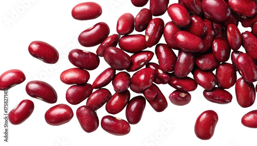 Close-up shot of a pile of shiny, deep-red kidney beans on a stark, black background