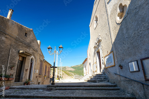 A narrow street among the old houses of Atena Lucana, a village in the province of Salerno, Italy.