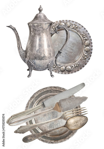 Fotografía vintage tarnished silver service set with an antique coffee pot, decorative plates, and old silverware, isolated photograph