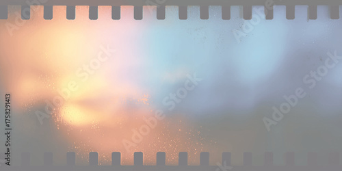Fiery orange and blue sky with film strip border light dust