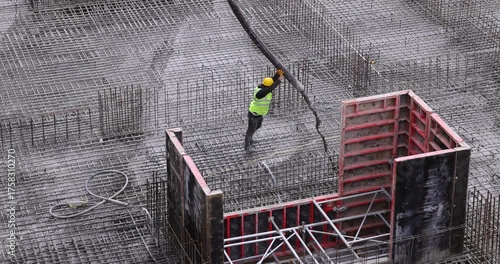 Pouring Concrete with a Boom Pump Hose at a Construction Site | 4K Slow Motion