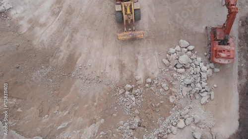 The loader loads crushed rock.