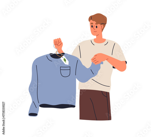 Eco clothing, slow fashion and sustainable shopping concept. Man holding garm...