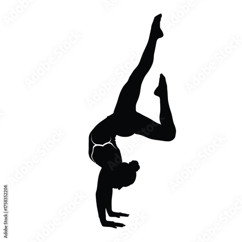 Silhouette of a gymnast performing a handstand with one leg straight up and the other bent down