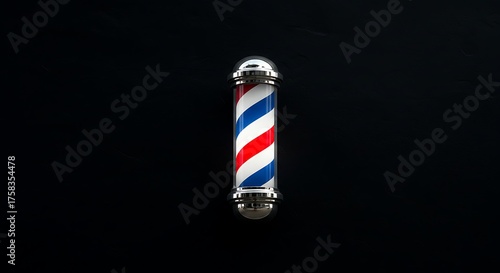 Barber shop pole against black backdrop with red white and blue stripes