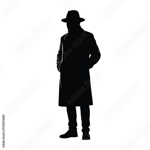Silhouette of a person wearing a hat and a long coat standing with hands in their pockets