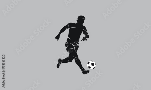 Silhouette of a soccer player kicking a football on a grey background