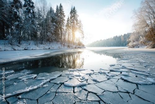 Frozen winter lake with cracked ice reflecting sunlight