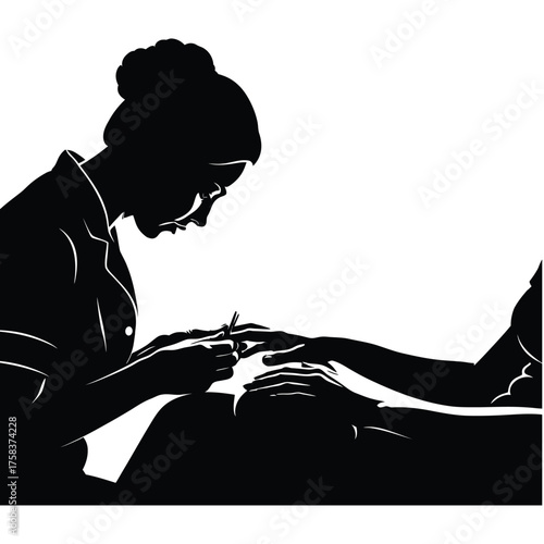Silhouette of woman giving manicure to another person in a salon setting in black and white
