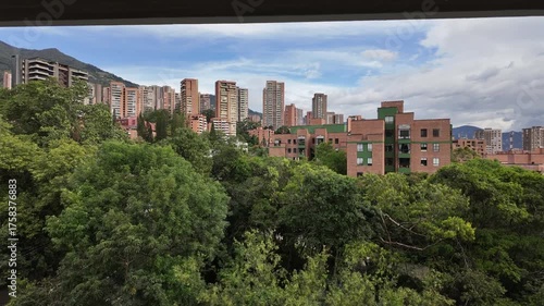 Clouds moving above city buildings, time lapse