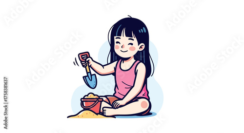 Cute little girl playing with a bucket and shovel in the sand on a sunny afternoon