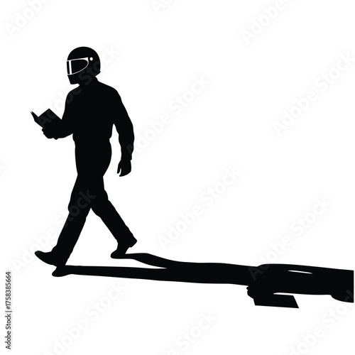 A silhouette of a person wearing a helmet and walking with a book in hand casting a shadow
