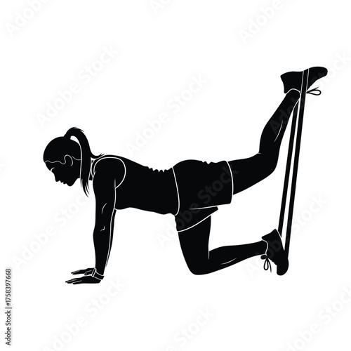 Silhouette of woman in shorts and tank top doing leg extension with resistance band on all fours