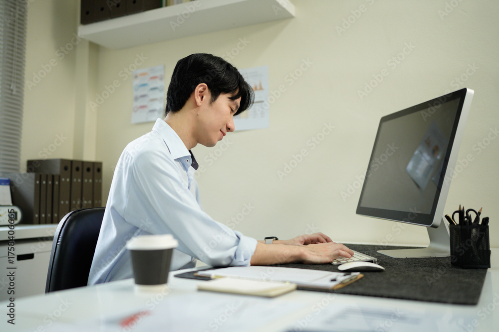 Fototapeta premium Business man, thinking and computer at desk in office for online research, reading email or report. Male entrepreneur person with internet connection for feedback, review and focus on project