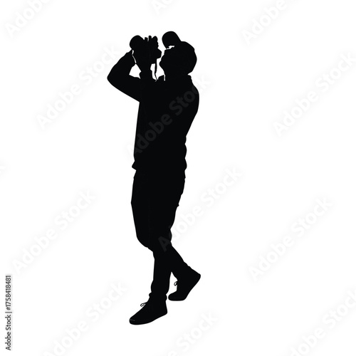 Silhouette of a person standing and looking up while holding binoculars to their eyes