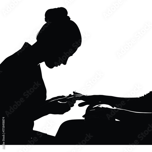 Silhouette of a woman giving a manicure to another person in a black and white image