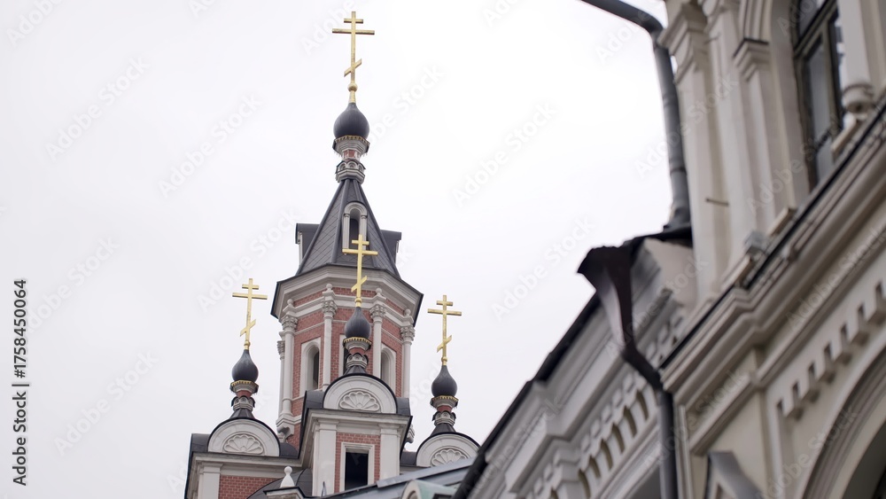 Fototapeta premium Golden crosses shining on russian orthodox church domes. Action