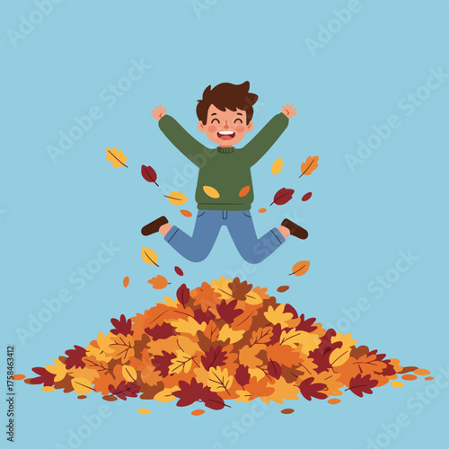 A joyful boy jumps into a pile of colorful autumn leaves