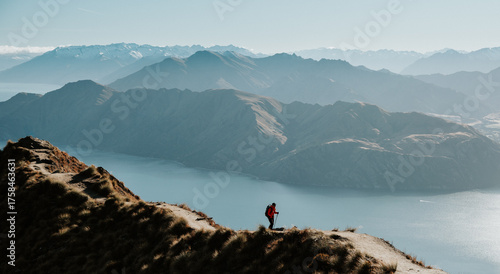 Hiker Walking on Roys Peak Track Overlooking Lake Wanaka, New Zealand
