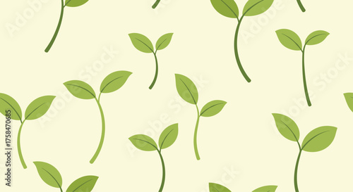 A pattern of tiny green sprouts on a pale yellow background.