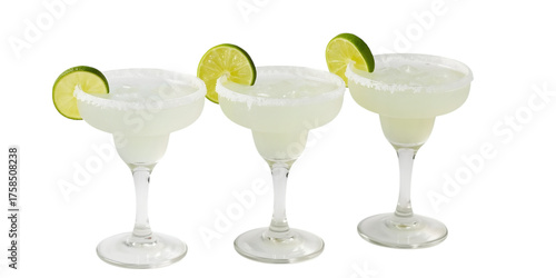 Refreshing Margaritas: Three elegant glasses are filled with a cool, vibrant margarita, garnished with a slice of fresh lime. Ideal for celebrating and relaxing.